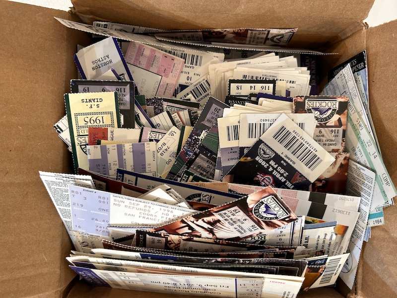 A box full of old baseball ticket stubs